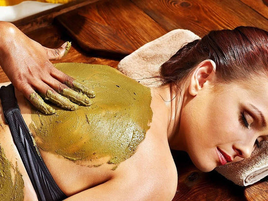 Woman with body wrapping after pregnancy
